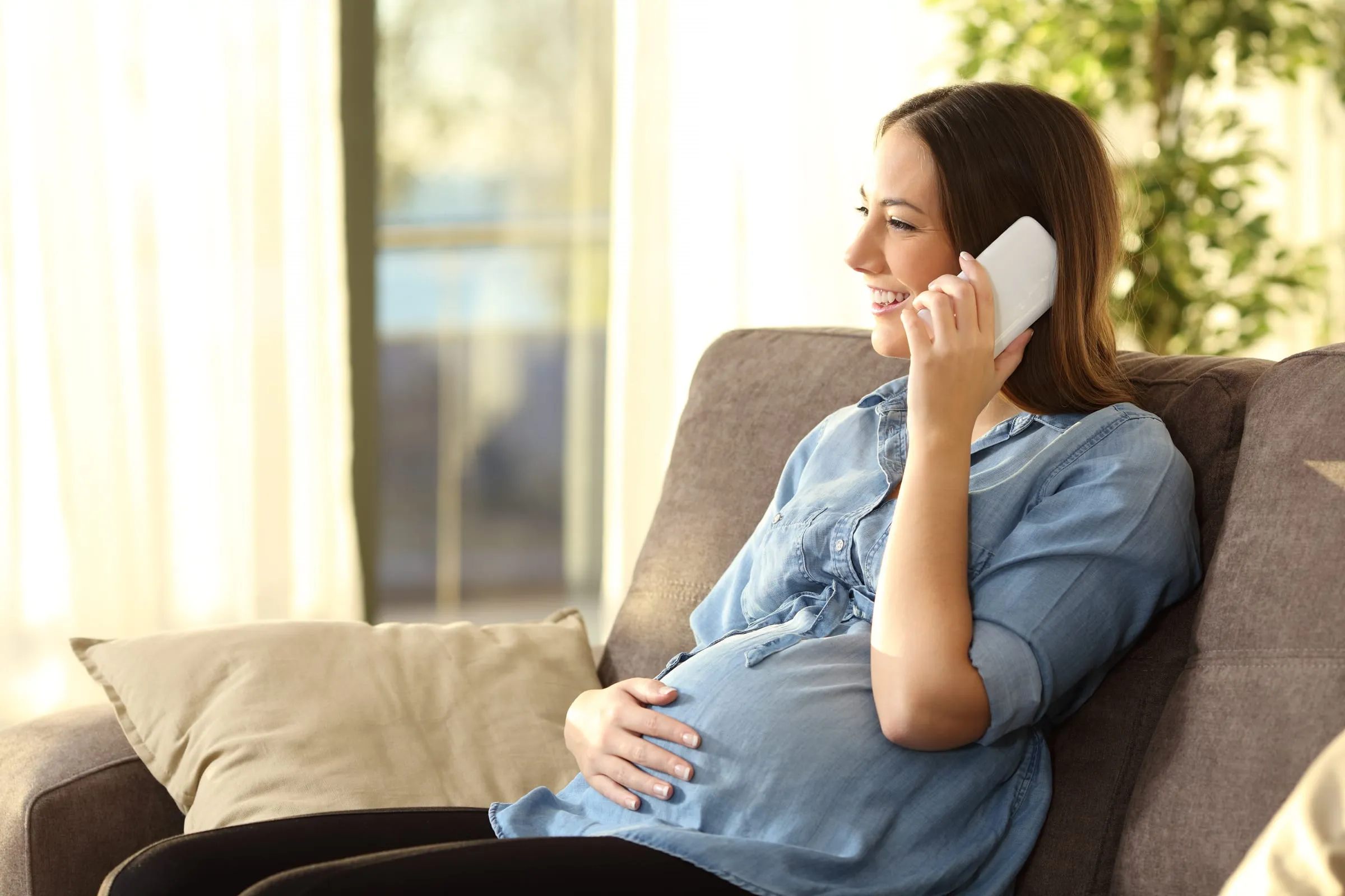A woman at home during a phone conversation